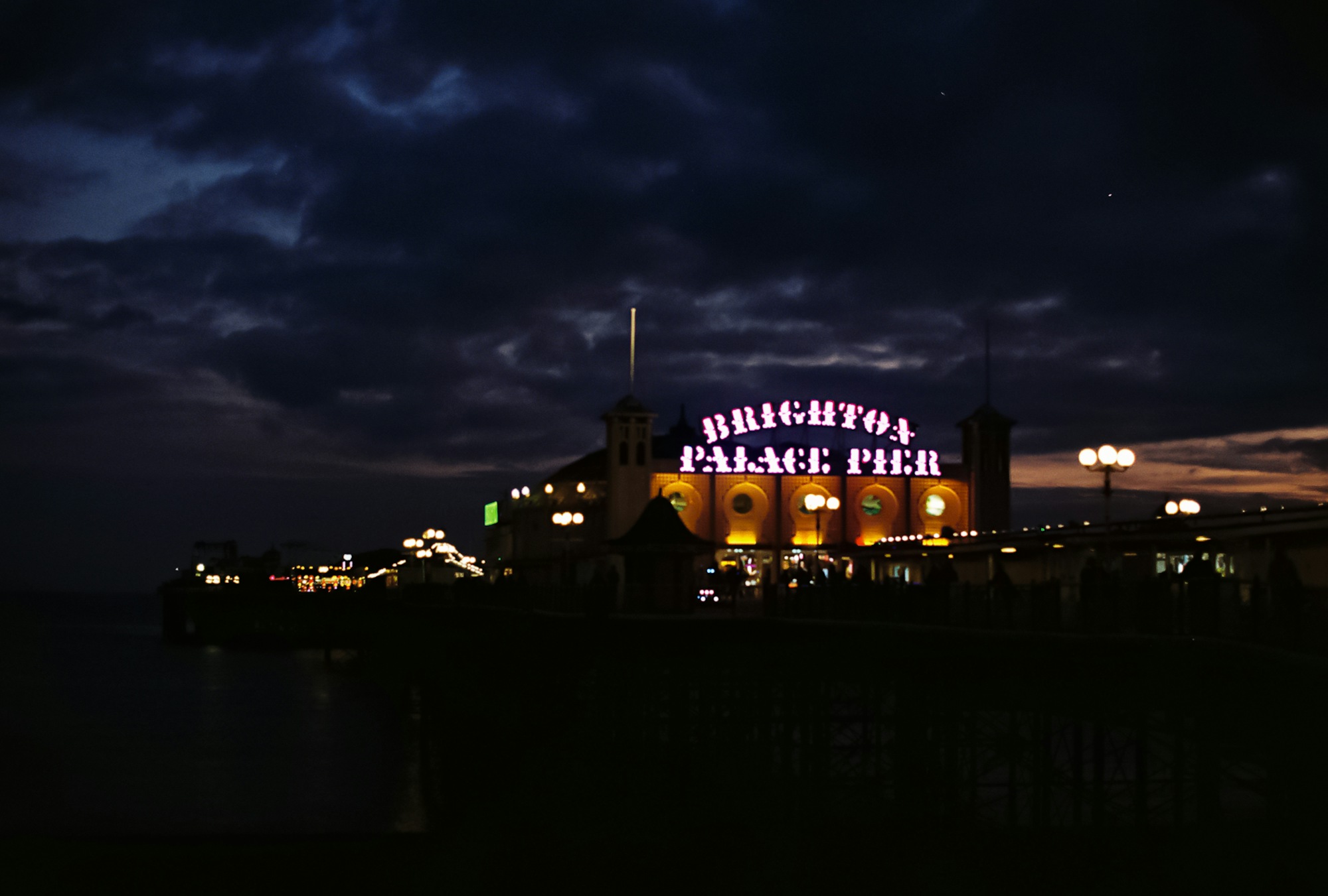 Brighton Pier illuminated at dusk